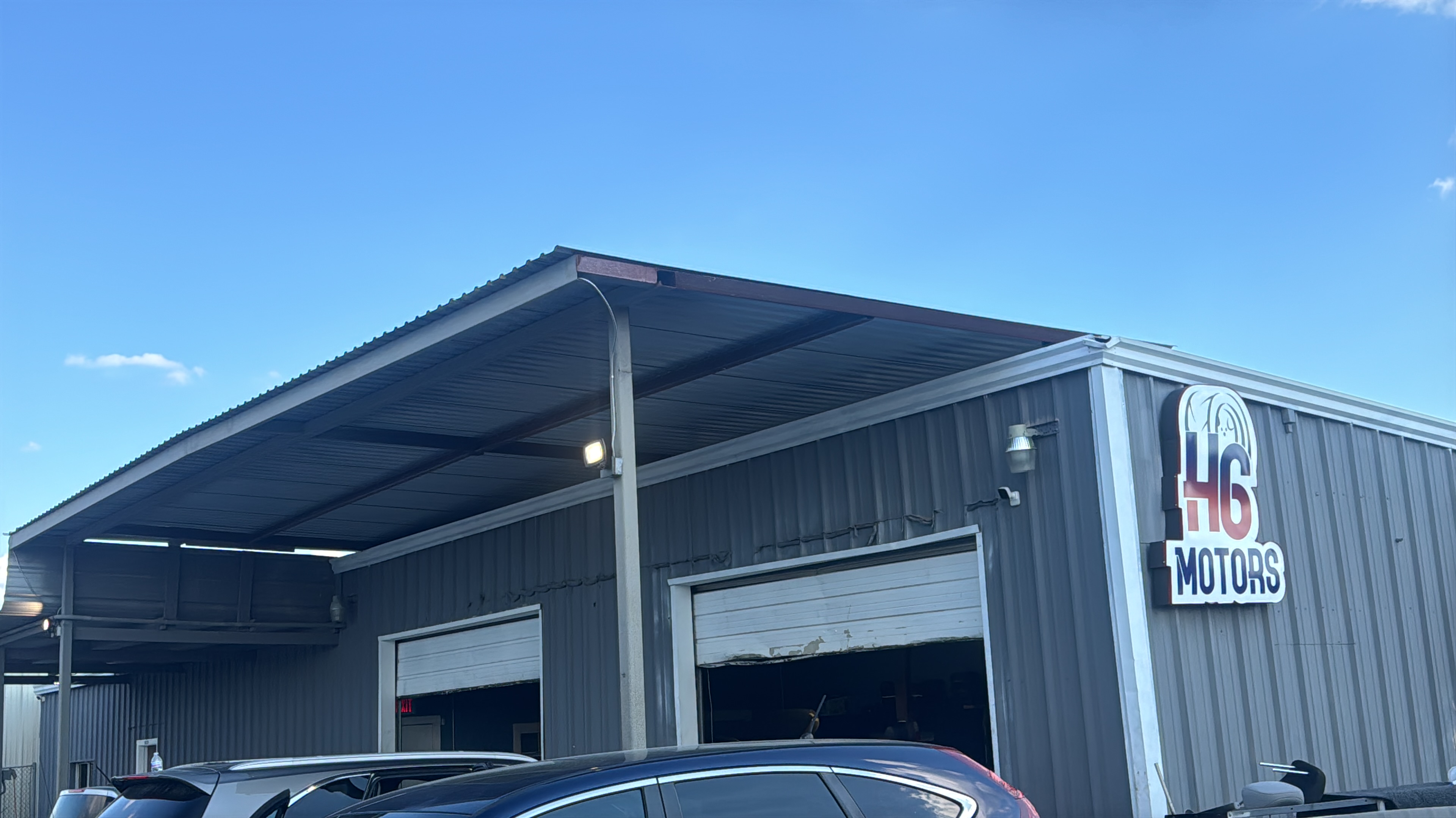 H6 Motors dealership building and sign